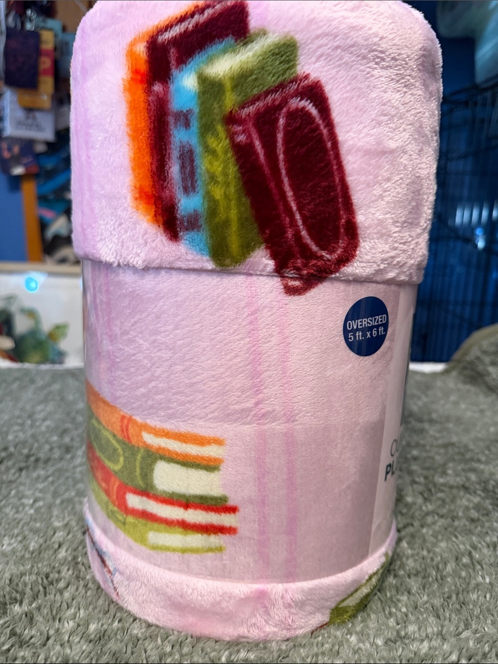 The Big One Pink Plush Throw Blanket with Multicolor Book Motif